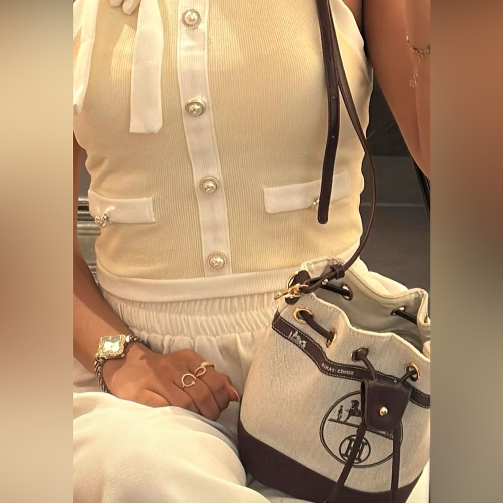 HERMÈS HERITAGE BUCKET BAG:
UPCYCLED ELEGANCE